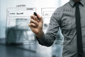 designer drawing website development wireframe