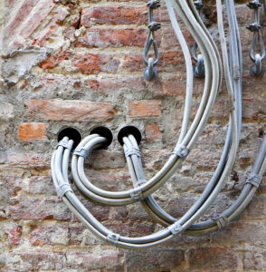 Electrical cables fixed on the wall
